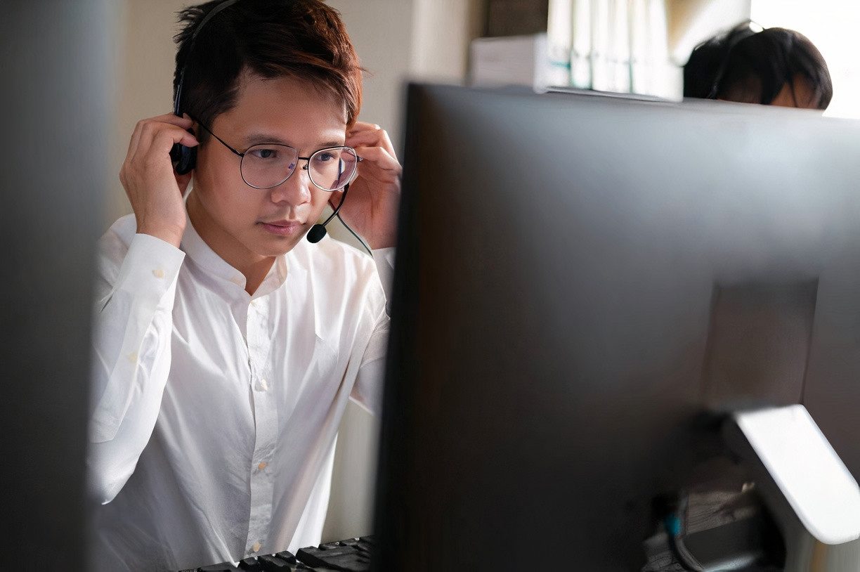 Asian guy having a discussion with client