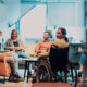 A group of diverse individuals informally networking in a quiet space at a corporate event