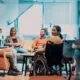 A group of diverse individuals informally networking in a quiet space at a corporate event