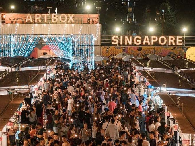 Attendees throng at Artbox Singapore. The event signage is clearly visible.