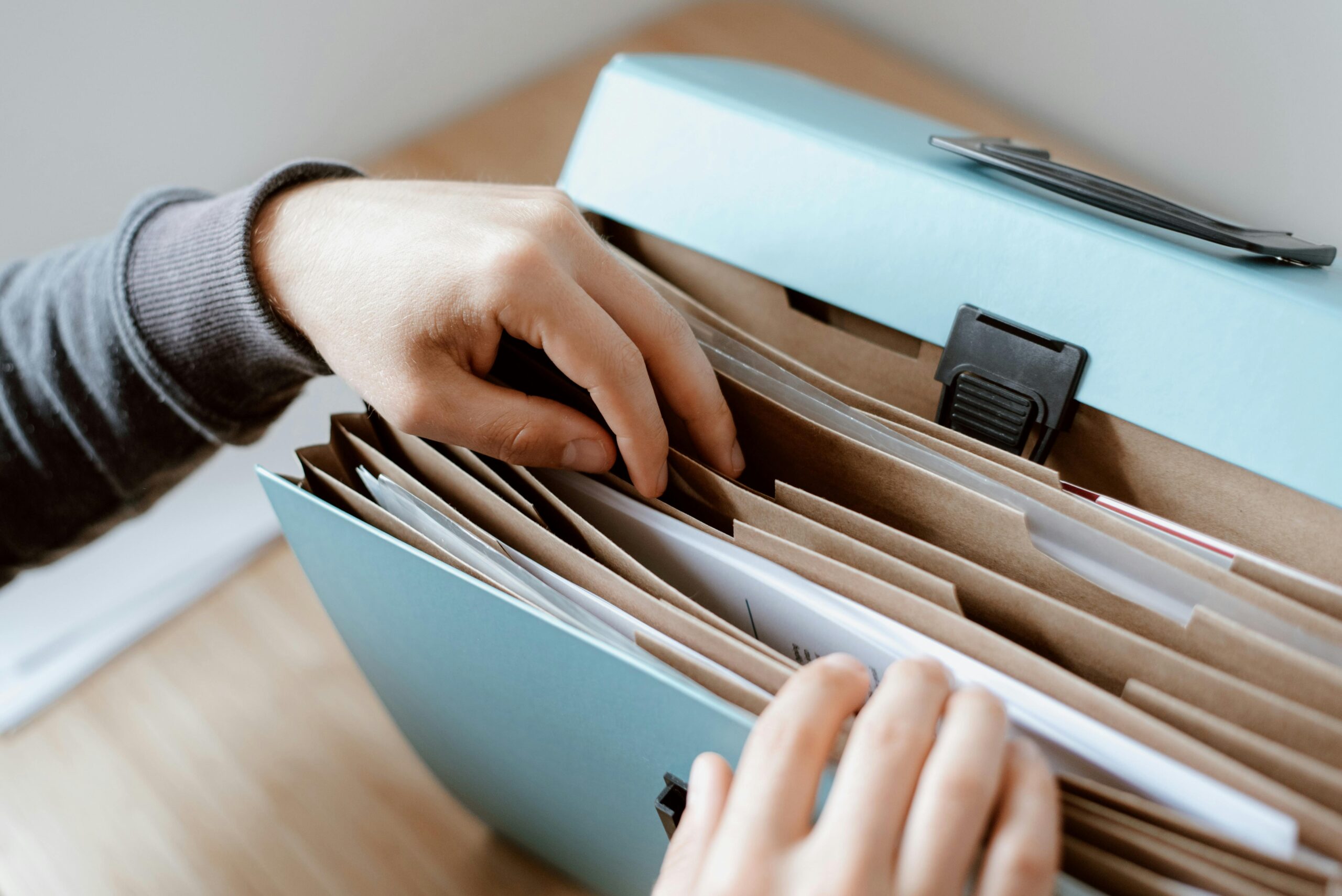 Event organiser reviewing licensing documents required for corporate events in Singapore