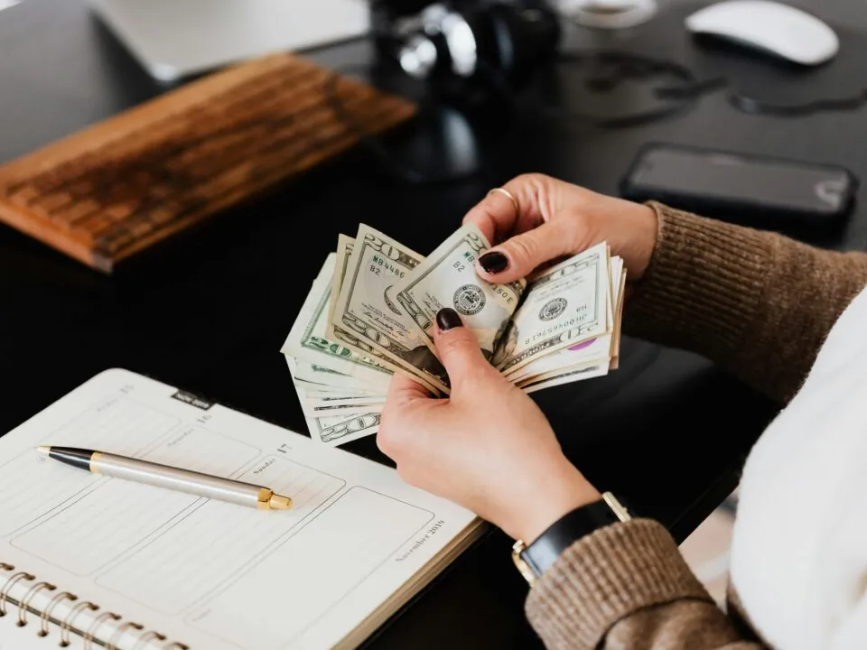 Cash being counted to plan event management budget with maximum impact and minimal overspending