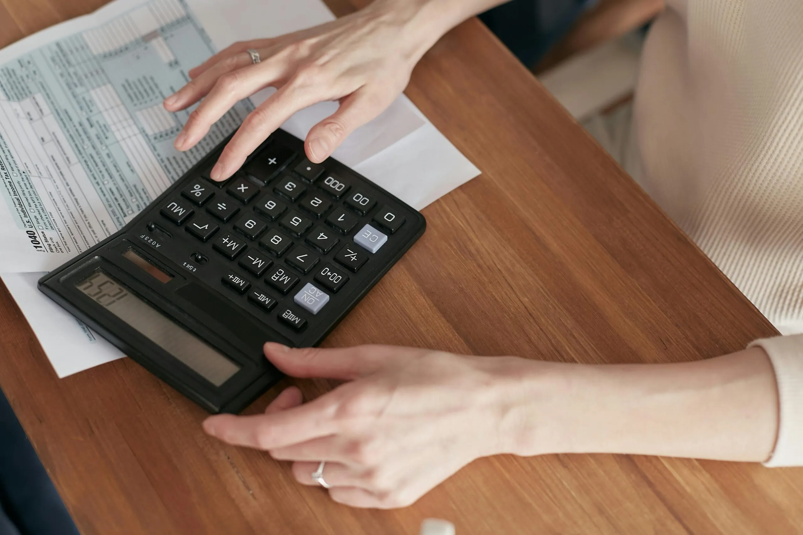 Event planner reviewing documents to avoid budget pitfalls in event management planning
