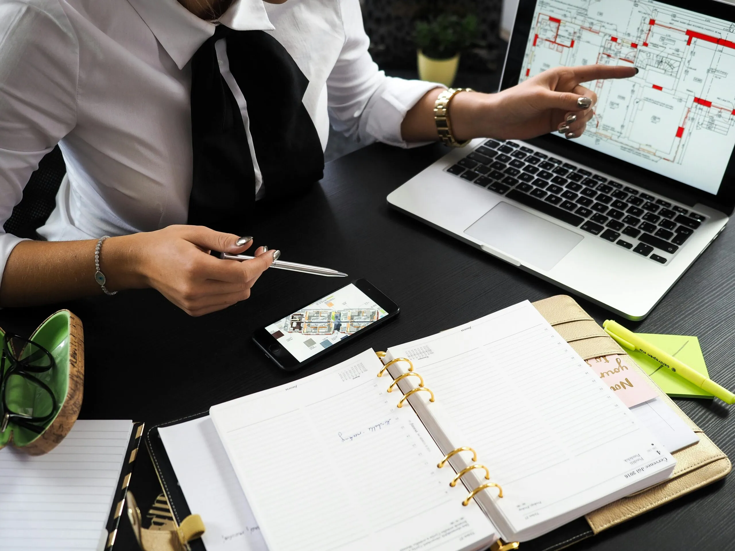 Team member reviewing vendor plan on laptop for an event management company Singapore