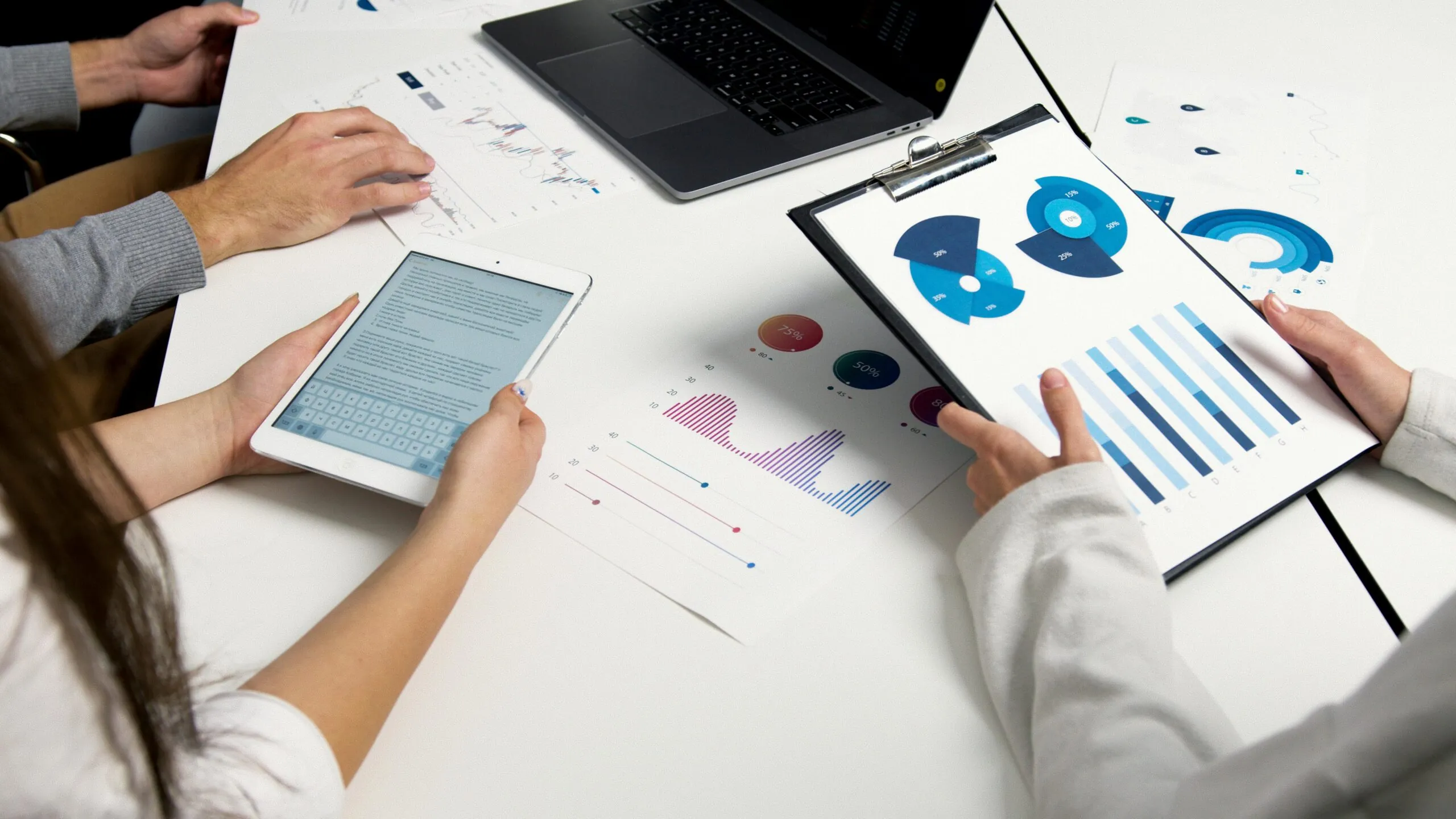 Event planner reviewing risk mitigation strategies and backup plans in event management