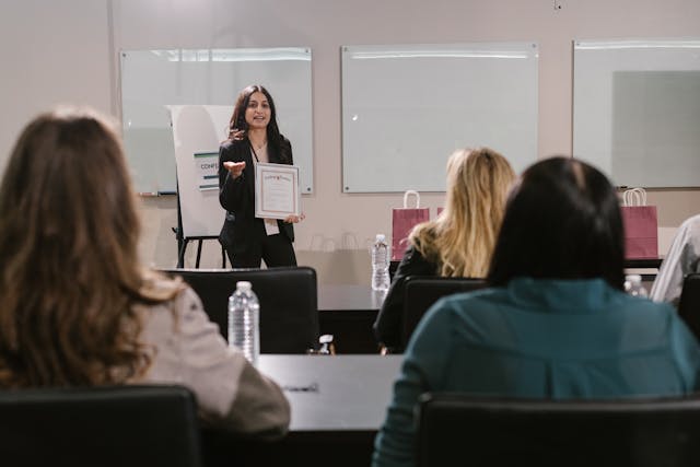 Woman enjoying a casual office event, highlighting attendee experience to be measured through feedback.