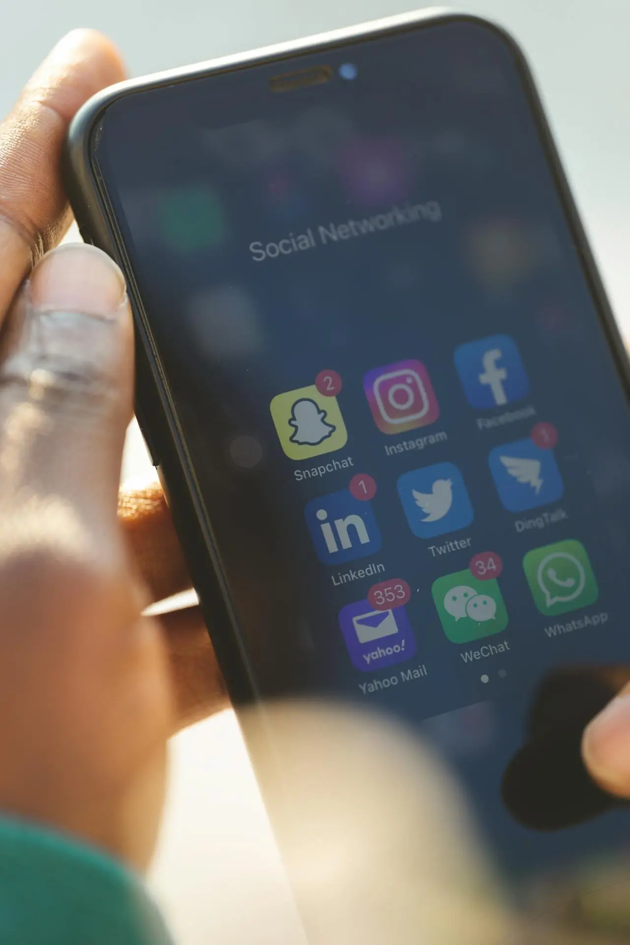 Smartphone displaying social media apps used for post-event photo sharing and engagement.