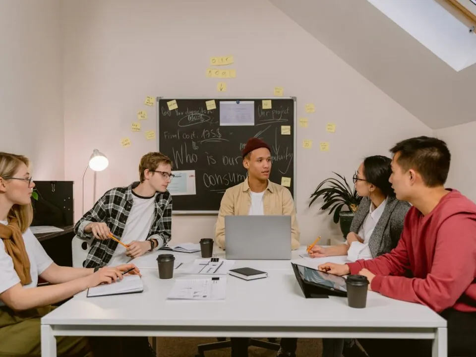 Event organisers reviewing attendee feedback together to plan improvements for future corporate events.