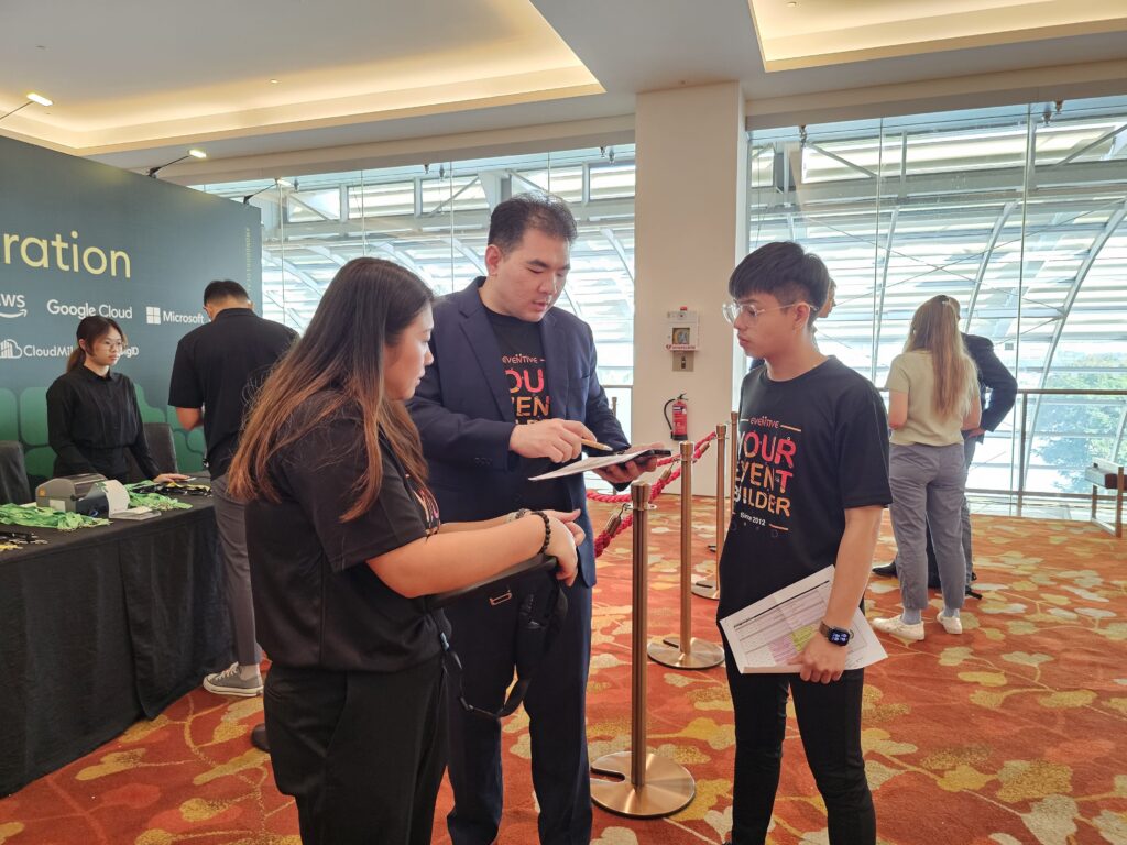 Eventive team coordinating on-site registration and attendee management at a corporate conference in Singapore
