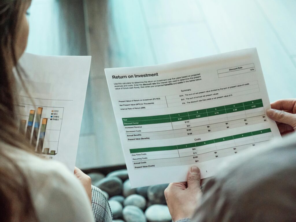 Reviewing return on investment report for corporate event management services in Singapore