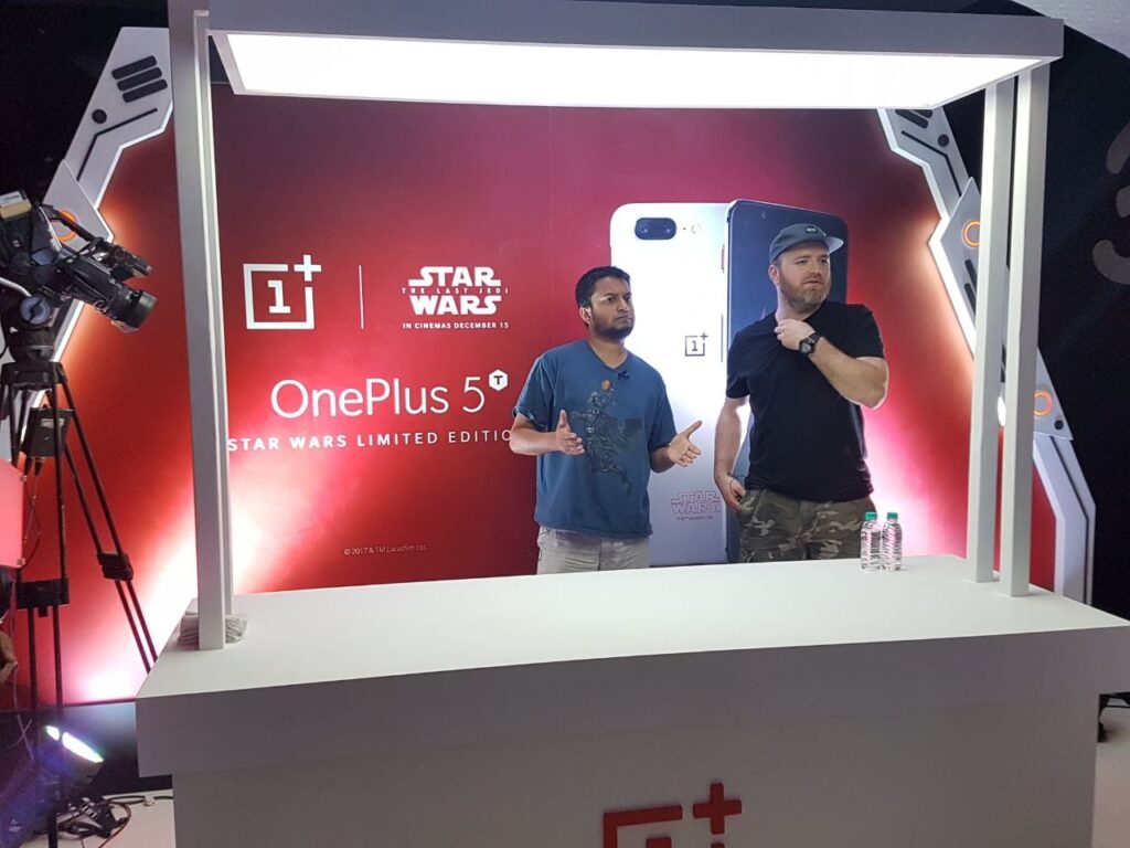 Product launch presentation with branded staging, live product demonstration, and professional event production setup.
