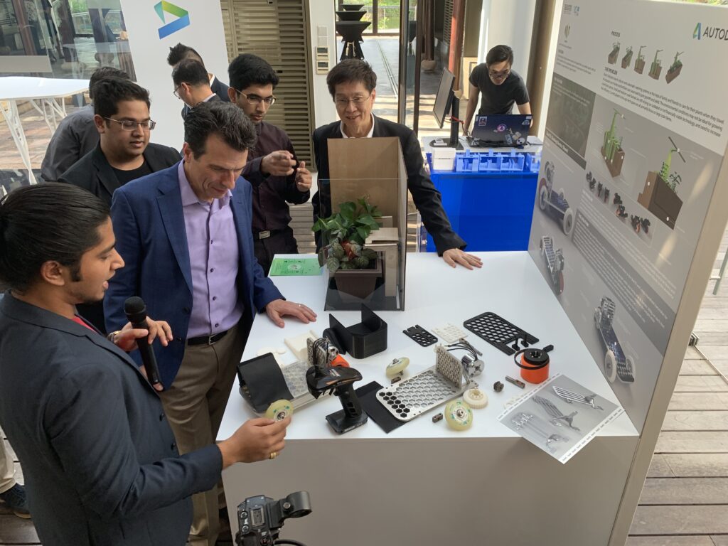 Guests engaging in a live demonstration during a product launch event managed by a corporate event team in Singapore.
