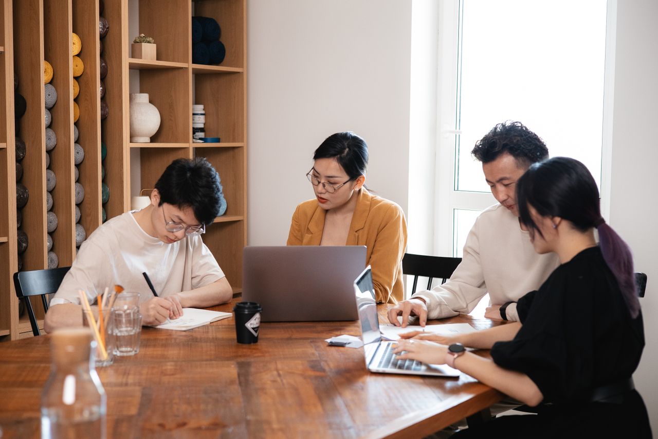 Corporate event management team using AI-powered planning tools to organise business events in Singapore.