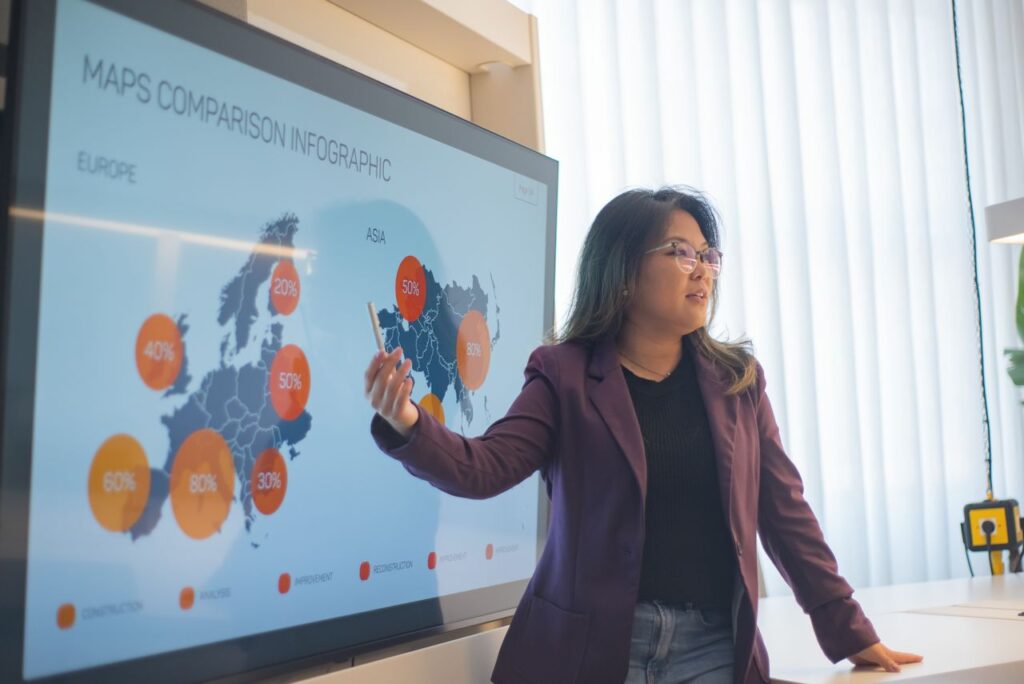 Corporate event planner presenting AI-powered planning strategies during a business meeting in Singapore.