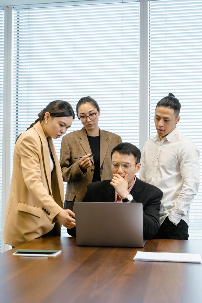 Corporate event management team reviewing event ROI and business performance to support future event investment